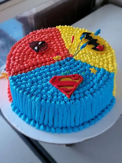 Why choose one superhero when you can have three? This cake is divided into sections for Spiderman, Batman, and Superman, perfect for a kid who loves them all.
