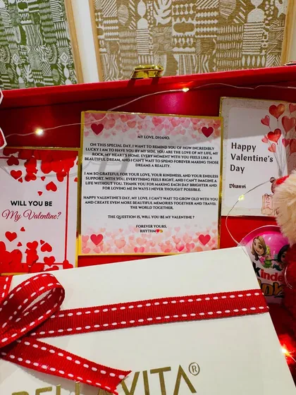 A close-up of the heartfelt letter and 'Will you be my Valentine?' card, making the gift deeply personal.