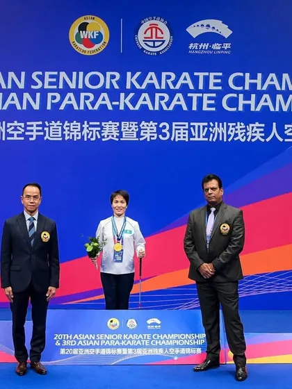 Standing with a medalist at the Asian Para Karate Championship. These athletes are an inspiration to us all.