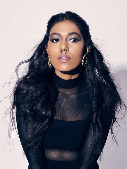 A powerful portrait with a bold, smokey eye and a strong pose. This type of makeup is great for creating an intense, high-fashion editorial look.