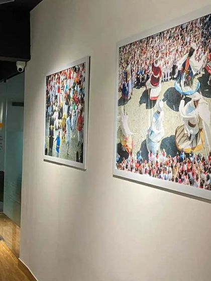 We used colorful and engaging artwork to add personality to the common areas of this co-working space. The large, framed prints create visual interest along the corridors and break up the monotony of the white walls.