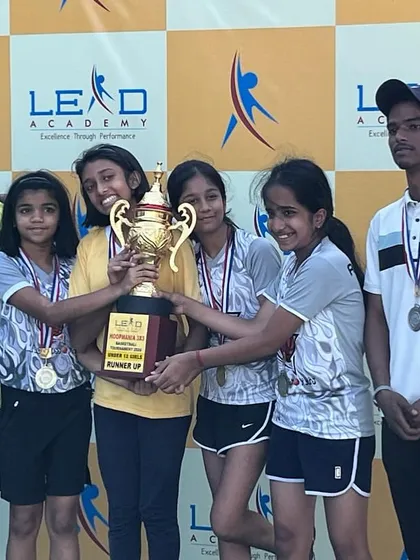 The U-12 girls team with their runners-up trophy at the CNS tournament. Their will to prepare and compete was outstanding.