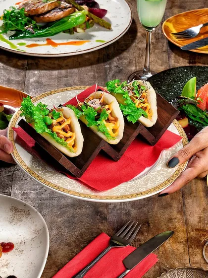 Indulge in a taste of the Mediterranean with our Cottage Cheese and Sun-Dried Tomatoes Open Bao. It's a delightful union of creamy and tangy in a fluffy embrace.