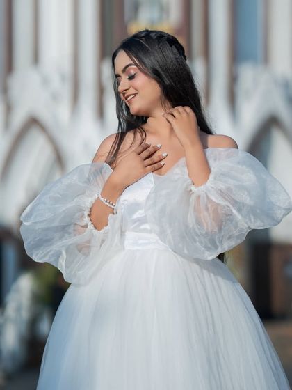 A sweet and gentle moment. The soft lighting enhances the angelic quality of the makeup and styling.