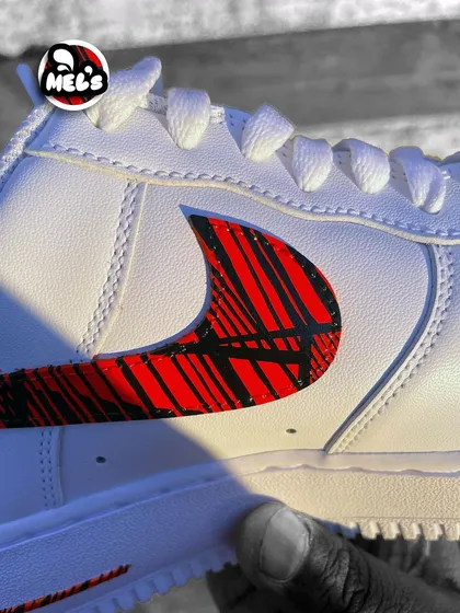 A close-up of the top of the patterned swoosh on the custom Nike.
