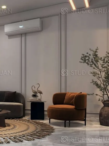 This lobby in Mansarovar Garden uses a warm, earthy color palette with modern, rounded furniture to create a welcoming and comfortable atmosphere.