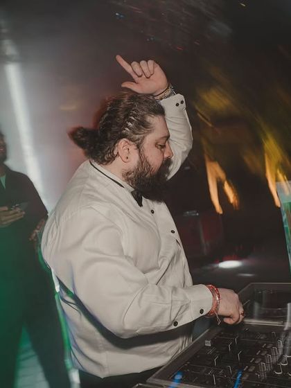 The groom's crew bringing unstoppable energy to the Parisian cocktail night, captured with a creative motion-blur effect.