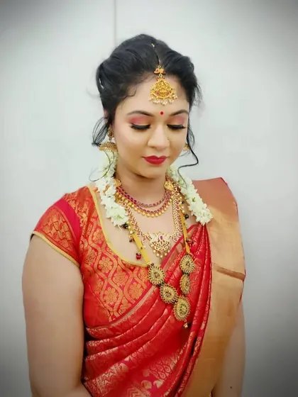 A soft, elegant South Indian bridal style with fresh jasmine flowers in the hair. We teach techniques to ensure the makeup remains fresh and flawless throughout long wedding ceremonies.