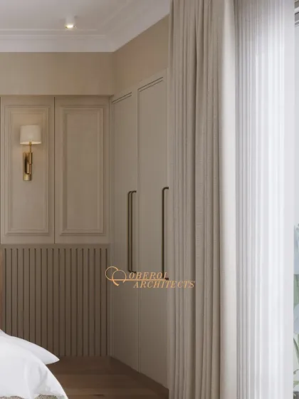 A detail shot of the seamless wardrobe and classic wall molding, showcasing the attention to detail in creating a refined, uncluttered space.