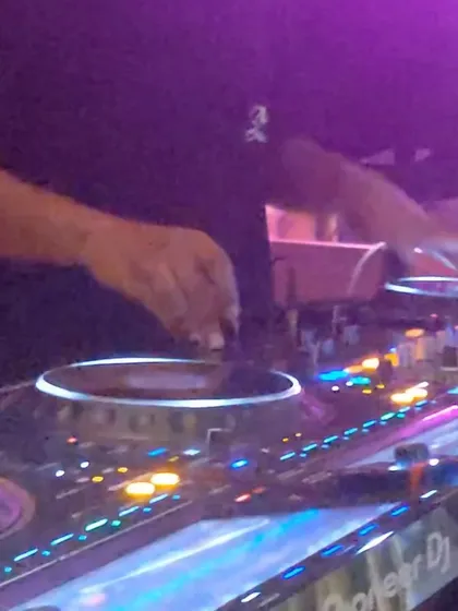 My hands on the crossfader during a drum and bass set. This is the core of my performance, making quick cuts and blends to keep the energy high and the transitions seamless.