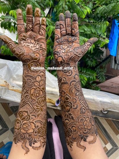 A beautiful outdoor shot of a full bridal mehendi, showing how the intricate details look in natural light.