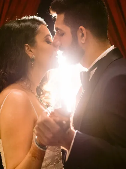 A close, intimate kiss, illuminated by a soft backlight. This shot is all about passion and connection, a moment of pure romance.
