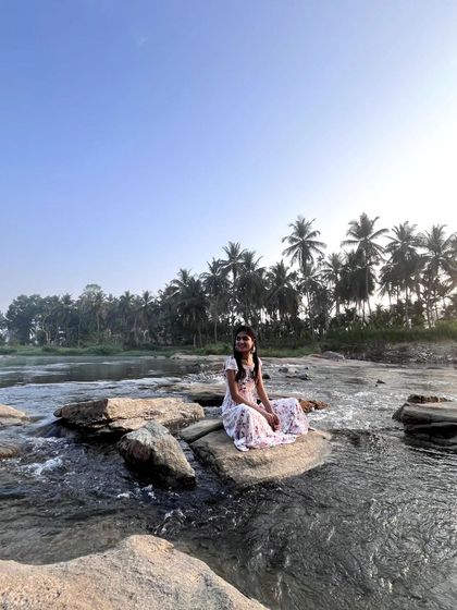 A happy, peaceful moment sitting on a rock in the middle of the river. This is what it feels like to be truly present.
