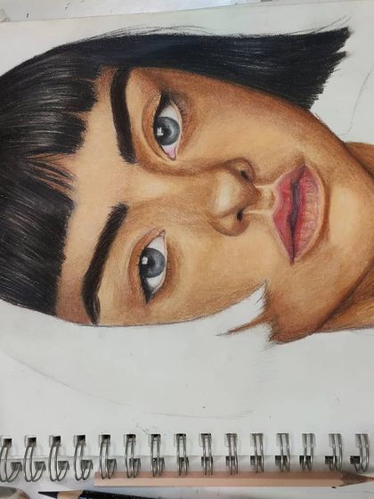 An angled WIP shot of the same portrait, showing the shading on the face.