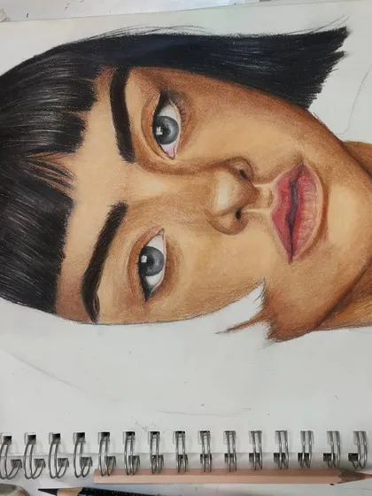 An angled WIP shot of the same portrait, showing the shading on the face.