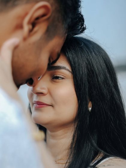 A tight, emotional shot focusing on the gentle touch and feeling of closeness between the couple, highlighting the intimacy of their bond.