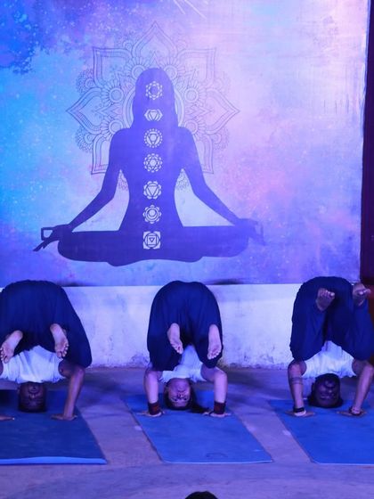 With my yogic family during our studio's second anniversary. Here we are in a headstand variation, demonstrating unity and shared strength.