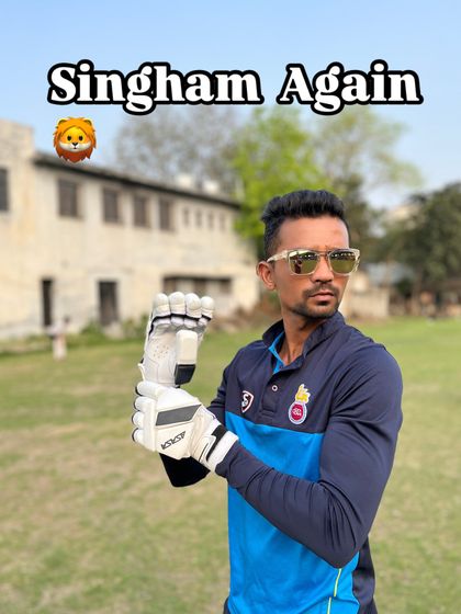 Putting on my batting gloves, ready for action. The right pair of gloves provides protection and a firm grip, which is essential for confident stroke play.