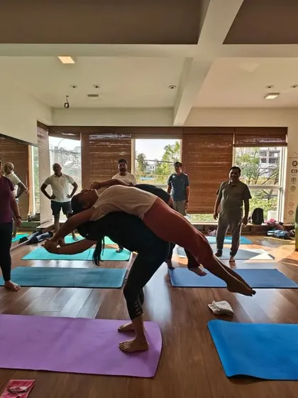 This assisted backbend, a variation of Fish Pose, feels incredible. The supporting partner helps lift the chest, allowing for a deep opening of the heart and release in the upper back.