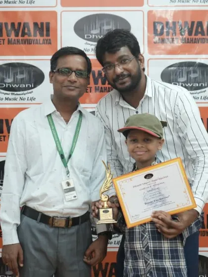 A teacher and his young student celebrating an award win together.