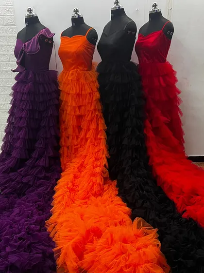 Just a small look at the variety I offer. These are some of my popular ruffle gowns, available for rent in multiple colors. You can visit my studio to see the full collection of over 150 outfits.