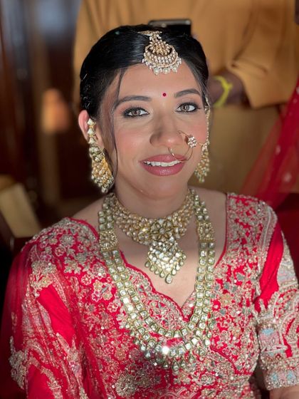 A close up portrait that captures her radiant smile. The focus was on creating luminous skin and enhancing her bright eyes for her wedding day.