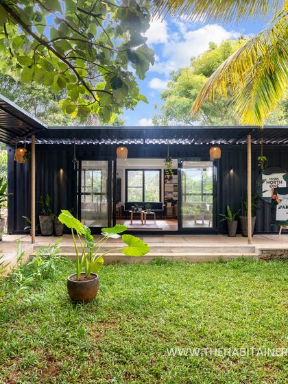 The exterior of the U-shaped container office, showing how the modules create a welcoming central courtyard.