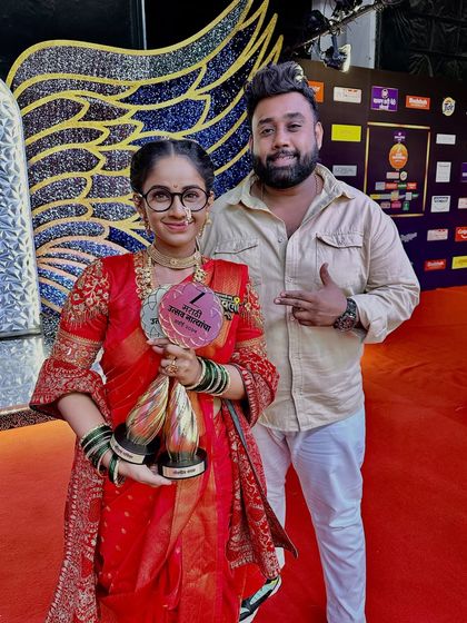 With actress Shivani Baokar, holding her awards at the Zee Marathi Awards ceremony.