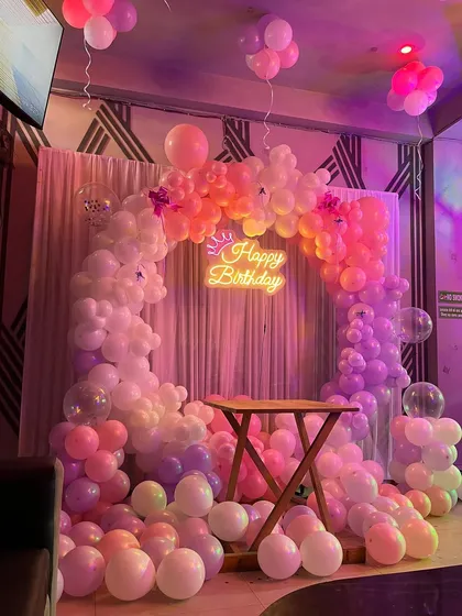 The party decoration seen from a distance, showing how it transforms the cafe space.