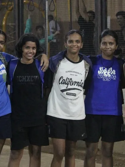 A group of players from our women's division posing for a photo after a match.