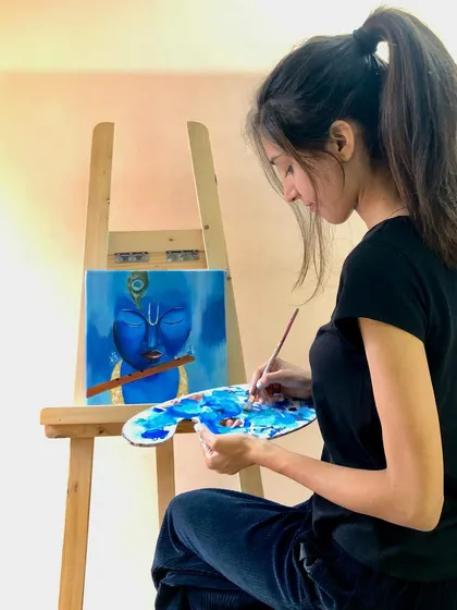 Here I am, lost in the process of painting a portrait of Krishna. This is my therapy, where I can focus on mixing the perfect shades of blue and capturing a feeling of tranquility.