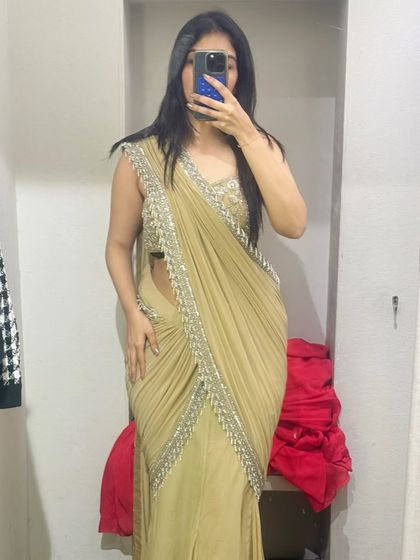 Another angle of the beige pre-draped saree. Trying outfits from different angles is crucial to ensure the fit and fall is perfect.