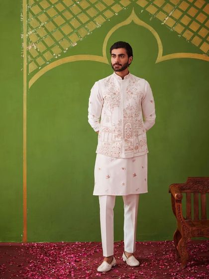 A full-length view of the white kurta set. The clean lines and the detailed waistcoat make it a timeless and versatile outfit for any festive occasion.