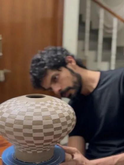 A collection of Prady's finished sgraffito and slip-work pots. His precision with geometric and floral patterns on rounded forms is just incredible.