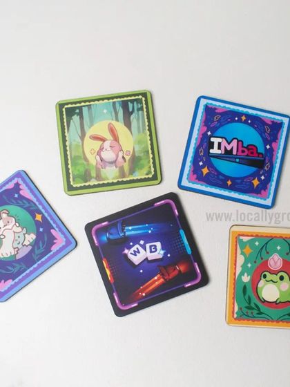 Protect your desk in style with these custom-designed tea coasters. This set features unique, colorful illustrations, showing the creative possibilities for even the smallest gift items.