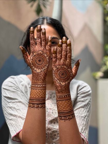 A lovely shot of a semi-bridal mandala design after the henna paste has been removed. The rich stain highlights the intricate details of the pattern.