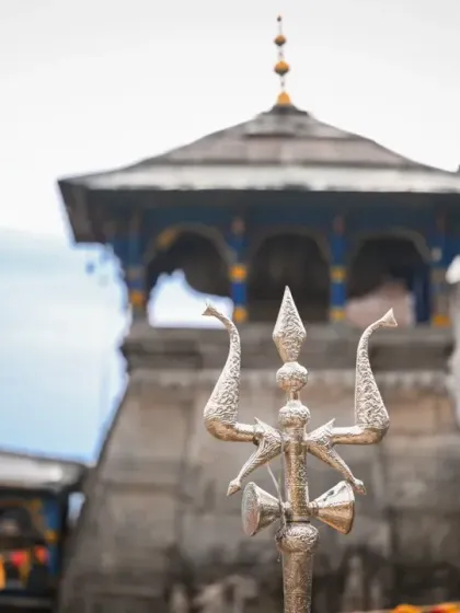 The silver trident (trishul) stands proud before the ancient Triyuginarayan temple, setting the scene for a wedding blessed by the gods themselves.