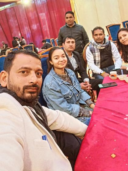 With family and colleagues at an event. Balancing professional and personal life is key.