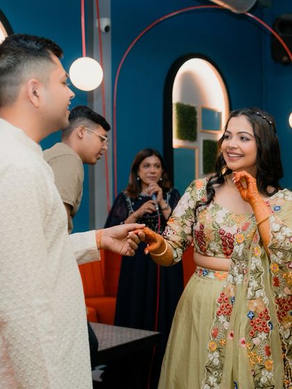 A sweet, candid moment between the bride and groom at their Mehendi function. These unposed interactions are what we love to document.