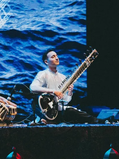 Performing in front of a screen showing ocean waves. I often use visuals from nature to enhance the calming and meditative effects of the music.