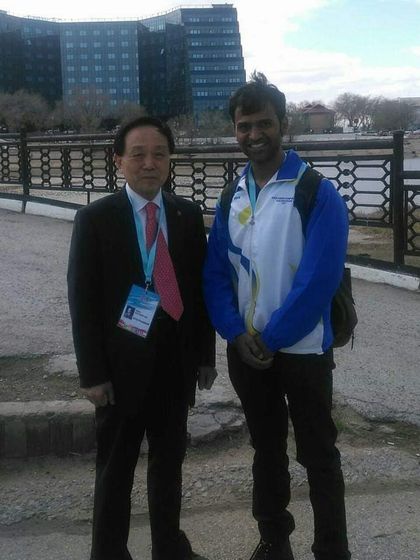With a high-ranking official at an international Taekwondo event. My work has allowed me to connect with leaders in the sport from around the world.