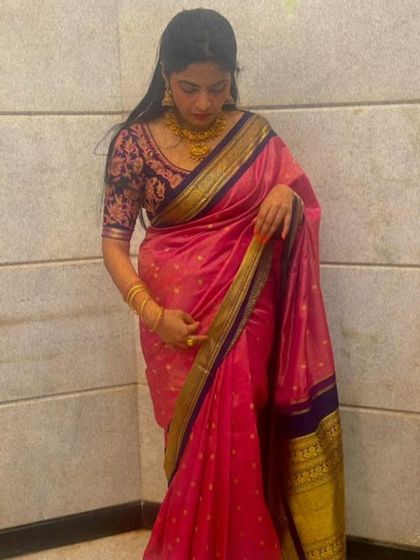 A full-length view of Neha's pink and navy blue ensemble, a sophisticated and elegant choice.