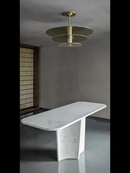 This is a bespoke ceiling light we designed in marble and brass for the entrance foyer of our Alibaug project. It acts as both a luminaire and a piece of sculpture, reflecting our obsession with creating one-of-a-kind details.