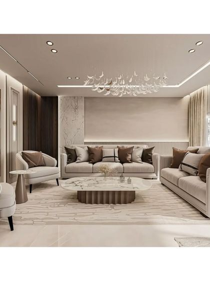 This living room showcases a harmonious blend of neutral tones, with a stunning leaf-like chandelier as the centerpiece. The layout is designed for conversation, with comfortable sofas and armchairs arranged thoughtfully.