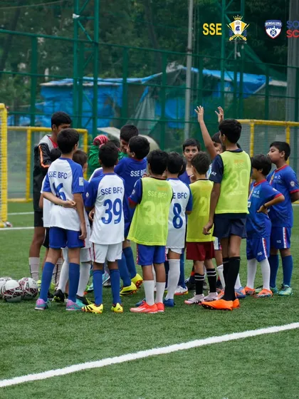 A team huddle during training. We teach our players that communication and teamwork are the keys to turning teamwork into triumph.