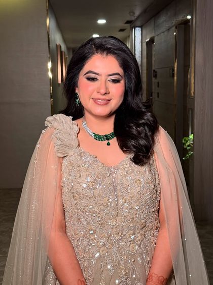 A close-up of Sanchi's engagement makeup. The shimmery eyes and soft pink lips create a look of youthful elegance.