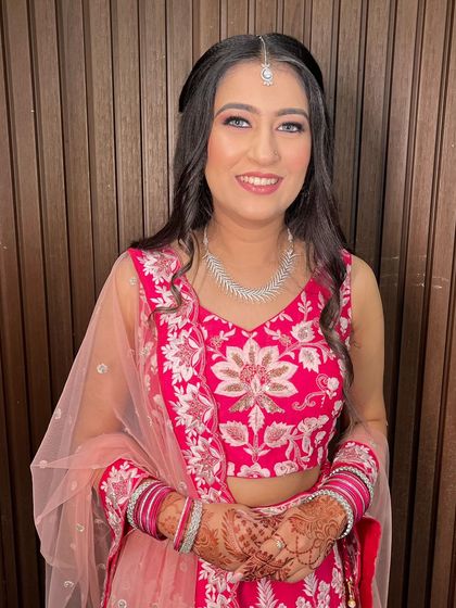 This bride is glowing with happiness on her engagement day. Our goal is always to create a look that enhances natural beauty and reflects the client's personal style.