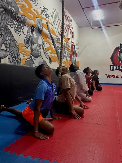 We always finish with essential cool-down stretches to improve flexibility and aid recovery. In this shot, the group is performing a guided stretch to release tension in the hips and back after an intense session.