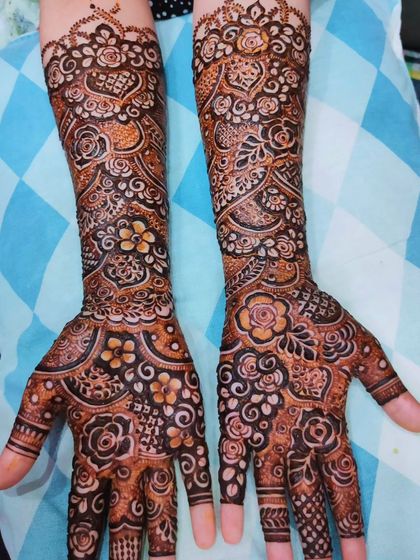 Two examples of my intricate bridal work, both featuring full-arm coverage and a beautiful final stain.