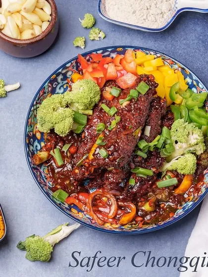 Our Safeer Chongqing Chicken is a sweet and spicy dish prepared with a variety of spices and sauces, served with colourful bell peppers and broccoli.